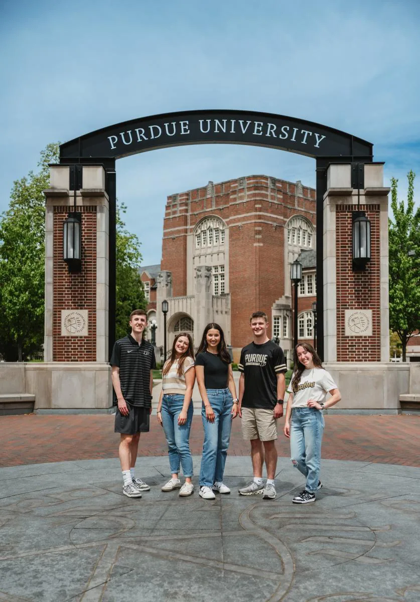 Students at the Purdue University gateway arch on campus